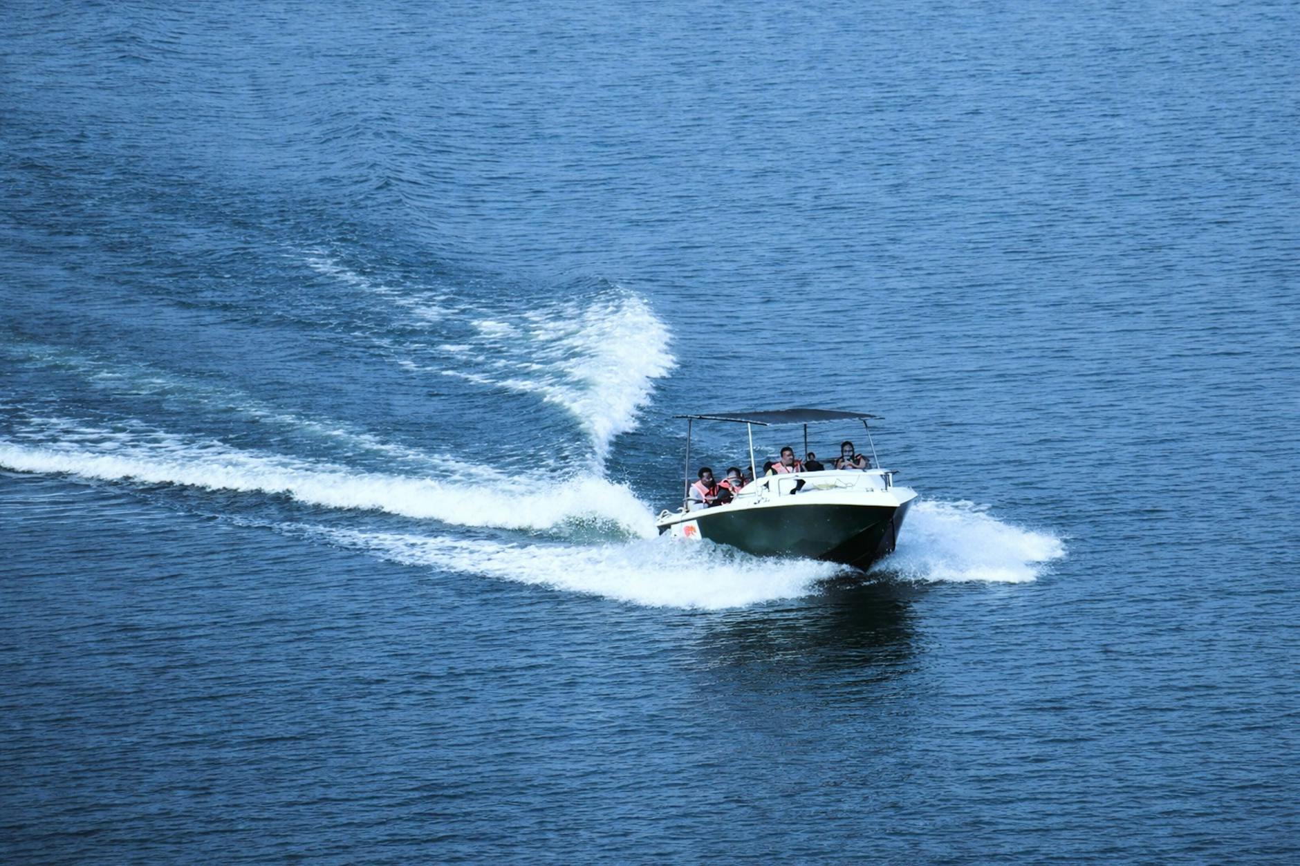 Speed boat creating spray on a river adventure ride