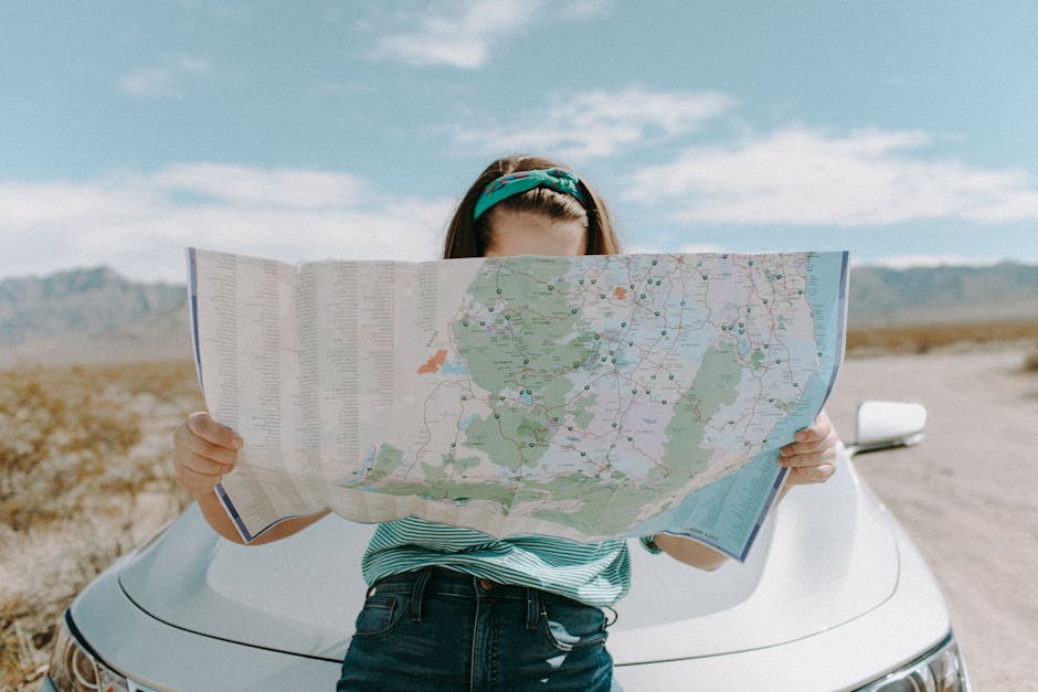 Solo traveller planning a route with a map