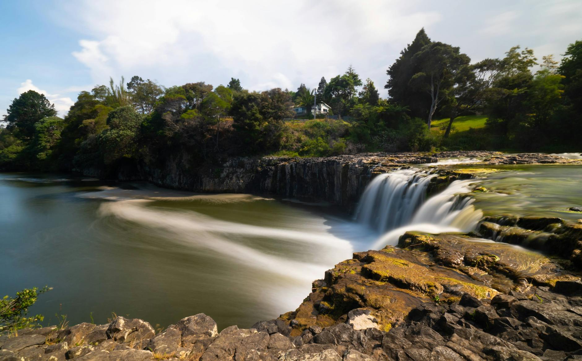 Powerful waterfall on a river in New Zealand similar to Huka Falls near Taupo