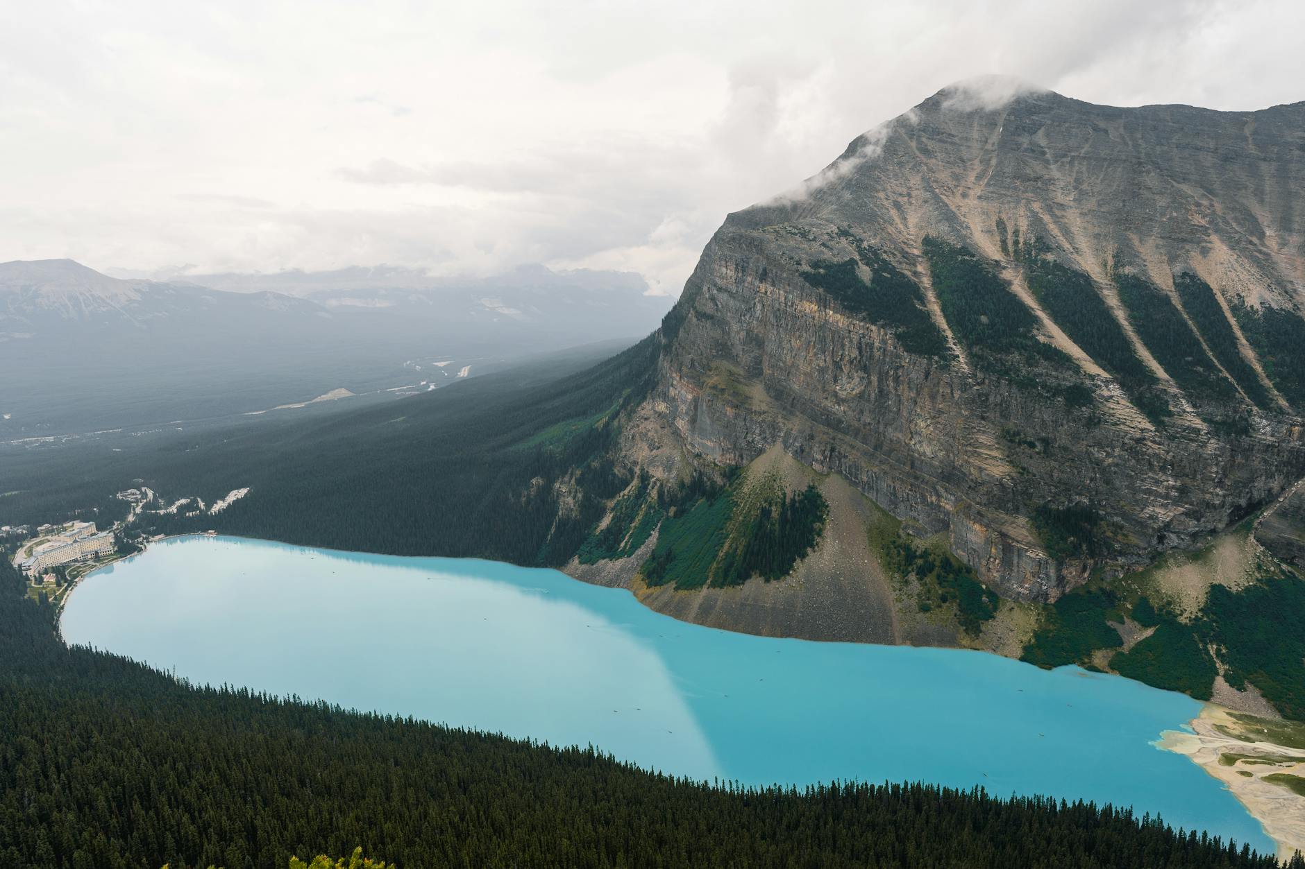 Scenic viewpoint overlooking a crystal clear lake surrounded by mountains