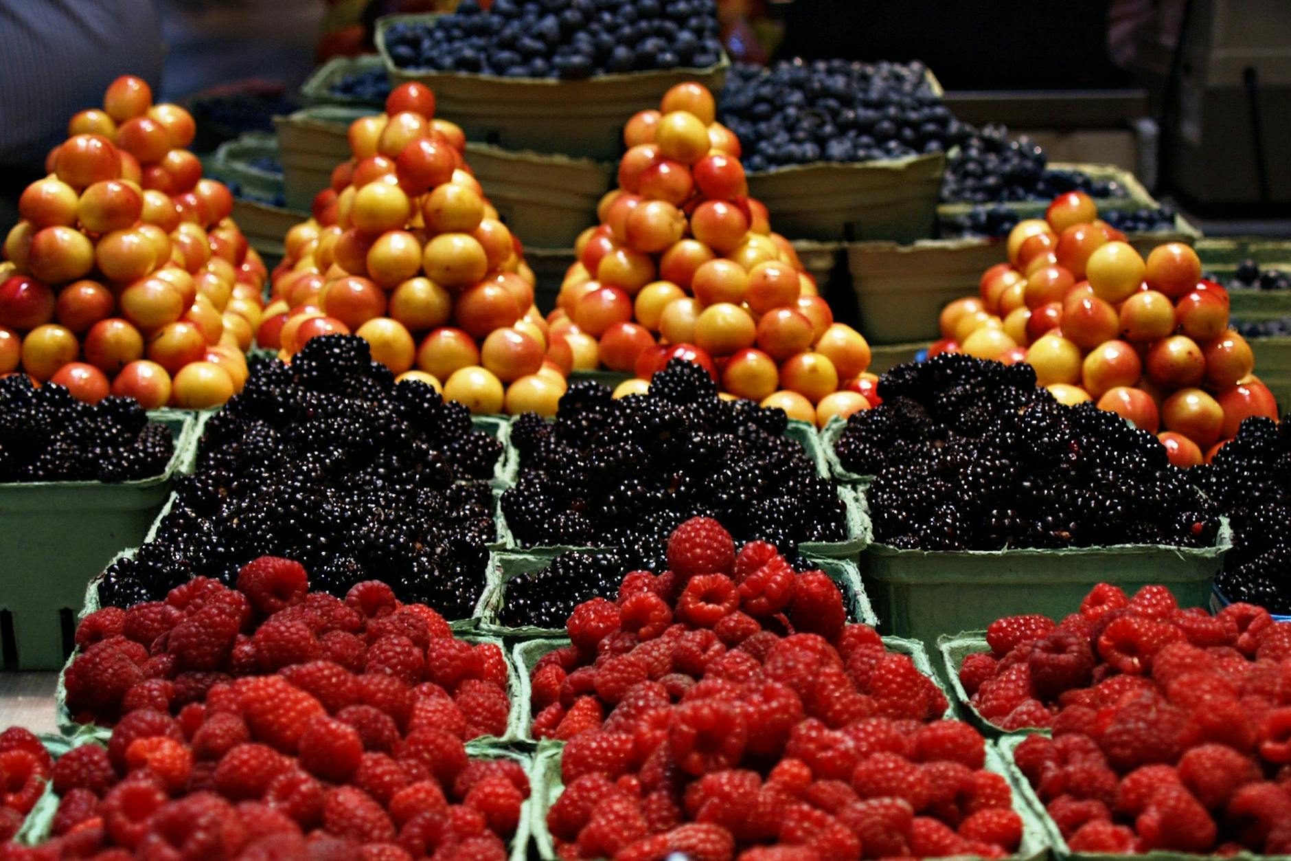 Colourful farmers market stall with fresh local produce and artisan food