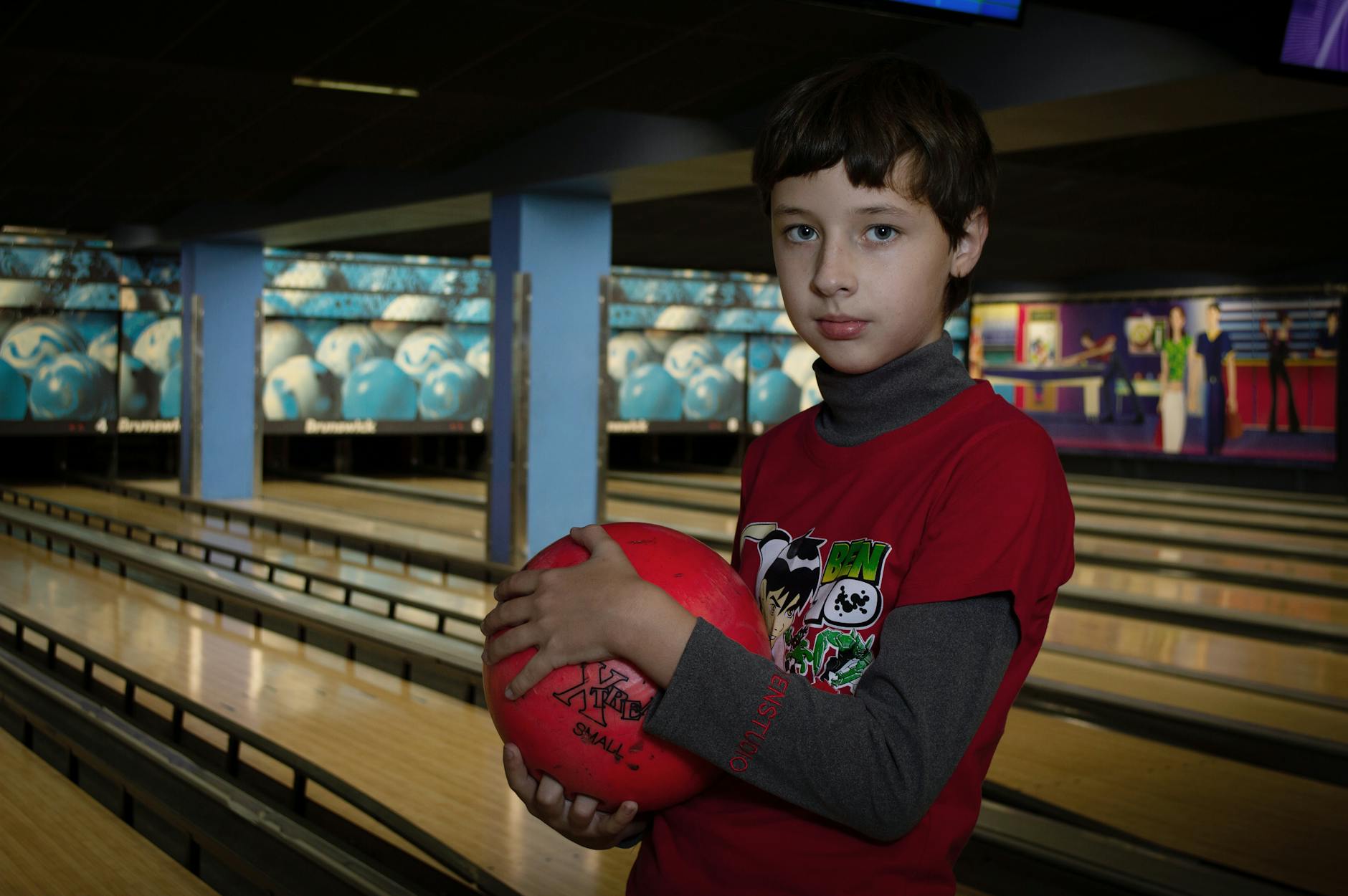 Kids enjoying indoor bowling entertainment perfect for rainy days in Taupo
