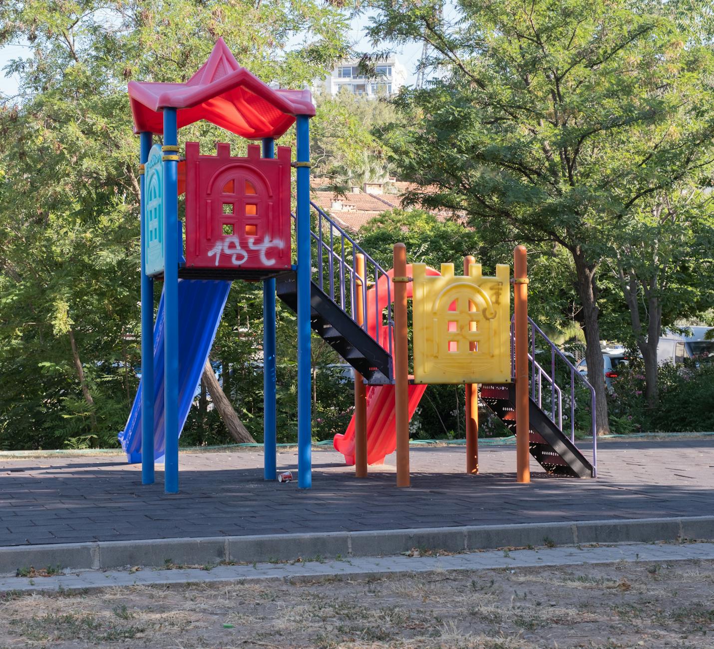 Children playing at an outdoor playground in a family friendly park near Lake Taupo