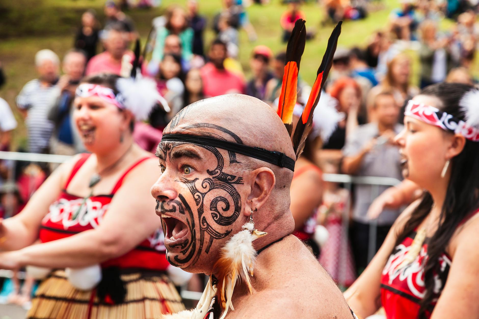 Maori cultural performers in traditional dress showcasing heritage near Lake Taupo