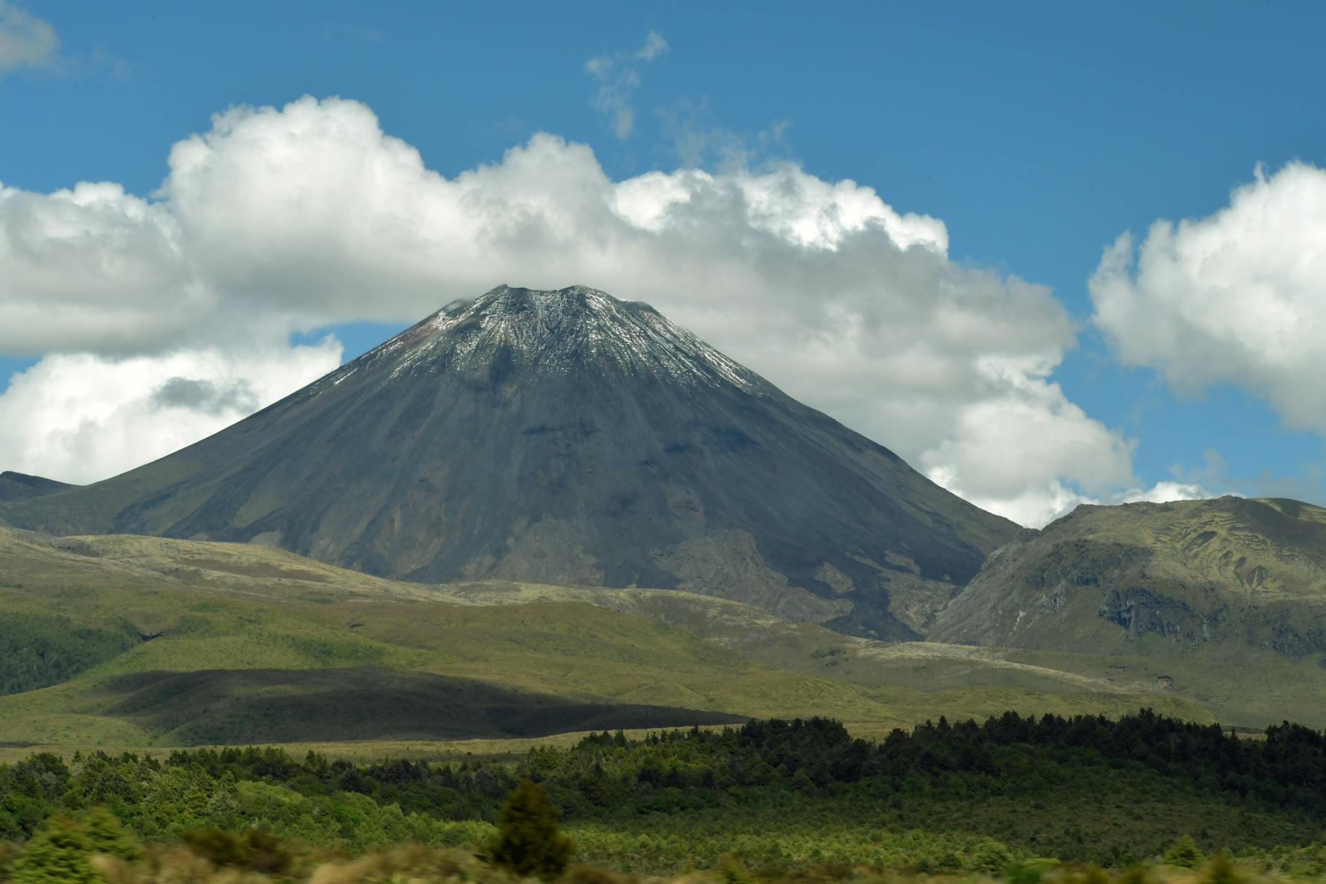 Snow-capped volcanic mountain in New Zealand similar to Tongariro National Park