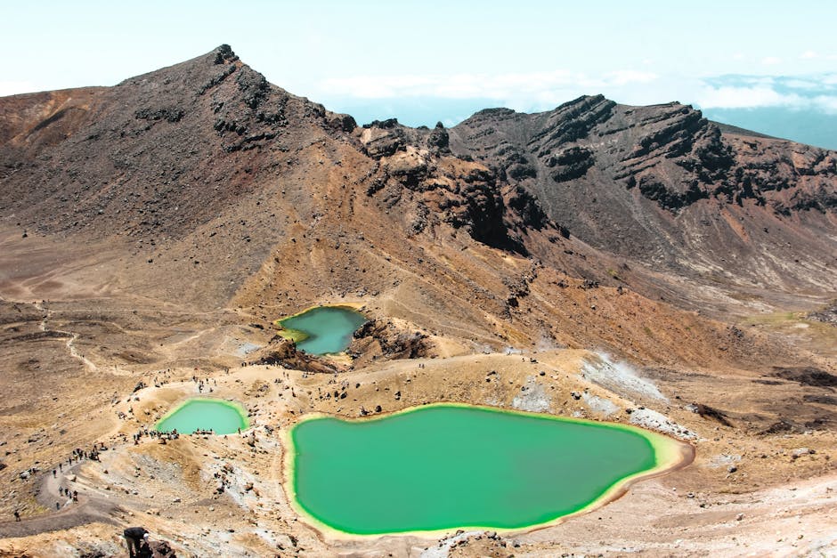 Hikers on the Tongariro Alpine Crossing volcanic landscape